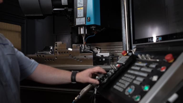 Employee working on Linear Plastics Capacity CNC machining centre