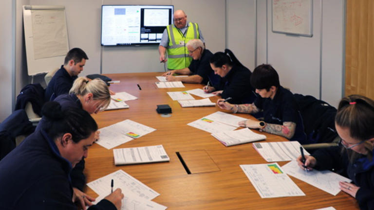 Linear Plastics staff in training room